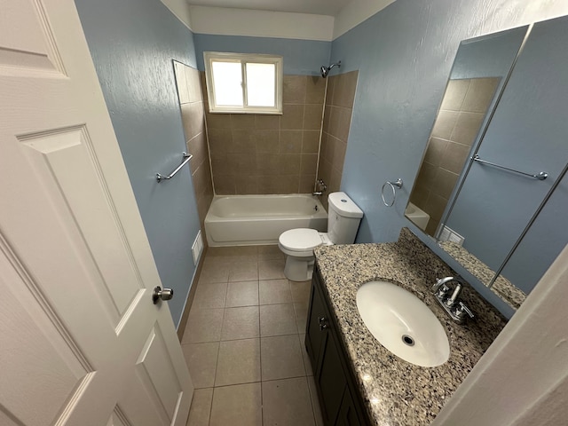 full bathroom with tile patterned flooring, vanity, toilet, and tiled shower / bath