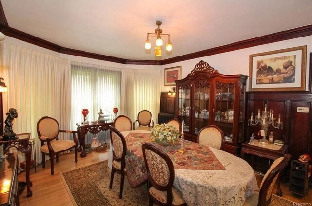 90 Edison St, Detroit, MI 48202 - dining room featuring ornamental molding and light wood-type flooring