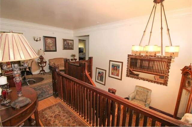 90 Edison St, Detroit, MI 48202 - stairway featuring ornamental molding and wood finished floors