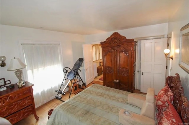 bedroom with light wood-type flooring