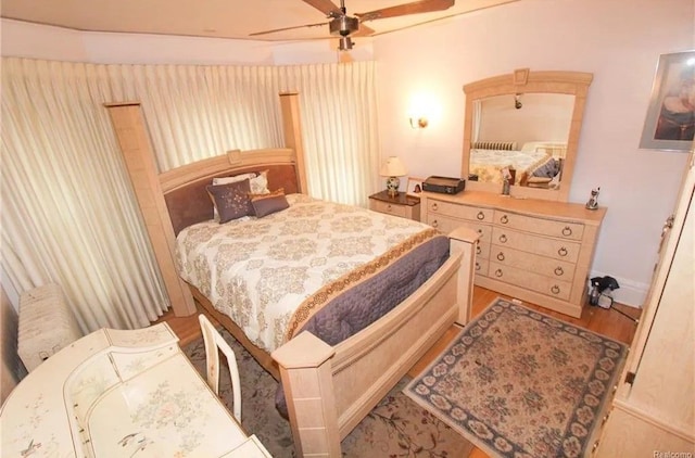 bedroom featuring light hardwood / wood-style flooring and ceiling fan