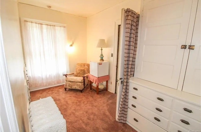 living area with a wealth of natural light and carpet floors