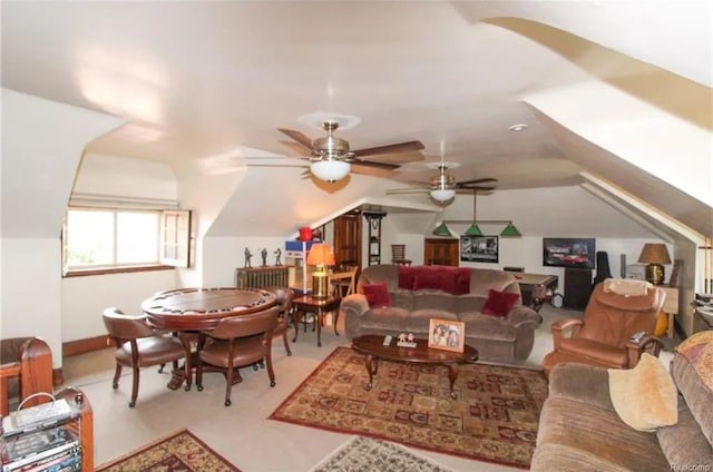 living room featuring ceiling fan and lofted ceiling