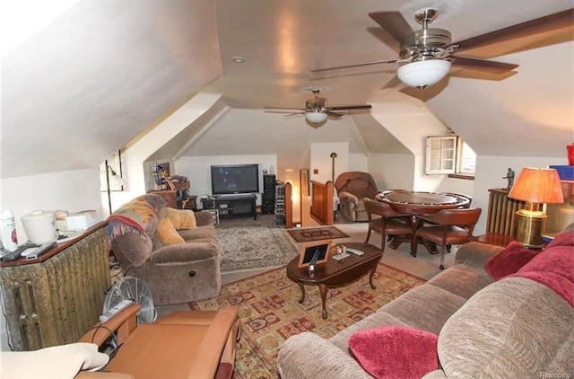 living room with ceiling fan, light carpet, and lofted ceiling