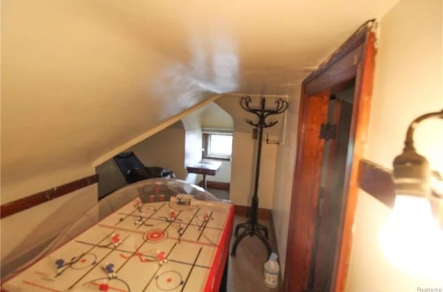 bedroom featuring lofted ceiling