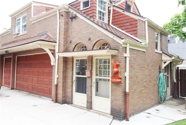 view of side of home with a garage