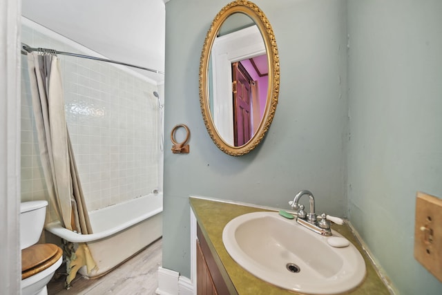 full bathroom featuring wood-type flooring, vanity, toilet, and shower / bathtub combination with curtain