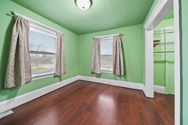 empty room with wood-type flooring