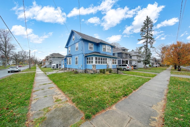 view of side of property with a lawn