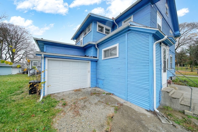 view of side of home with a garage