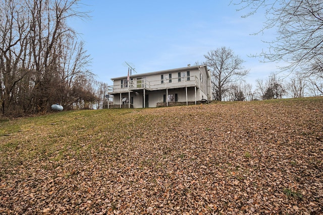 back of house featuring a deck