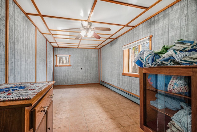 interior space featuring ceiling fan and a baseboard heating unit