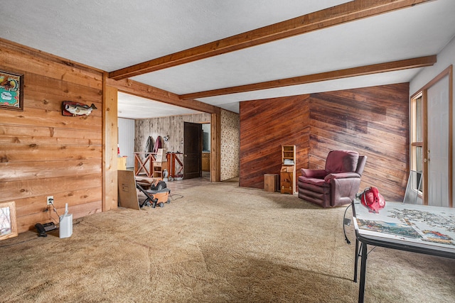 unfurnished living room with carpet flooring, lofted ceiling with beams, and wooden walls