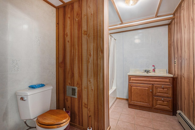 full bathroom featuring shower / bath combination with curtain, wooden walls, tile patterned flooring, toilet, and baseboard heating