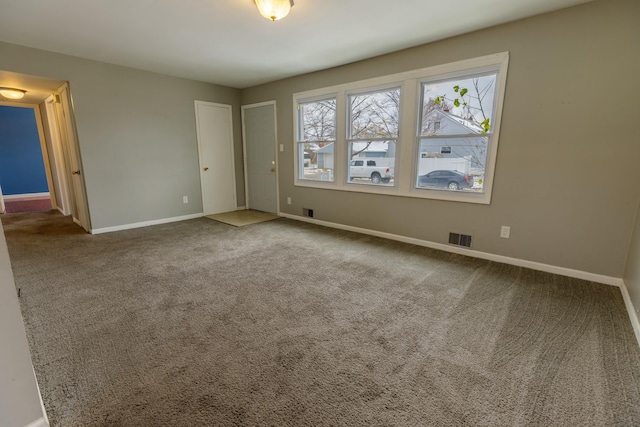 unfurnished room featuring carpet floors