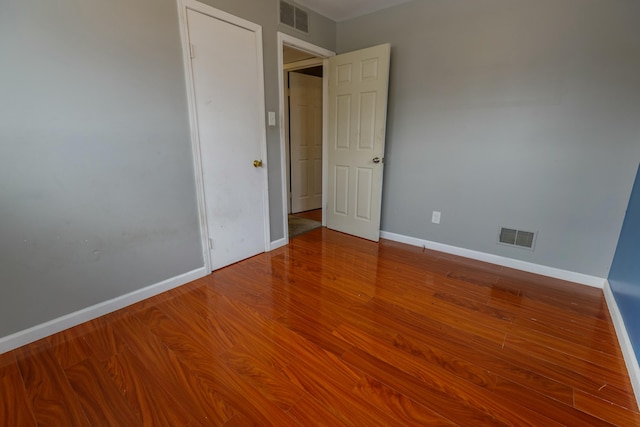 unfurnished room featuring hardwood / wood-style floors