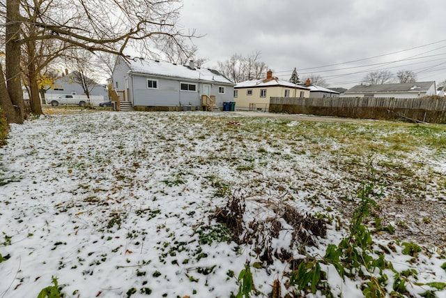 view of yard covered in snow