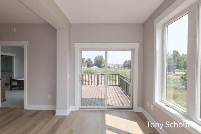 5184 Blendon Meadow Cir Unit 47, Hudsonville, MI 49426 - doorway to outside featuring wood finished floors and baseboards