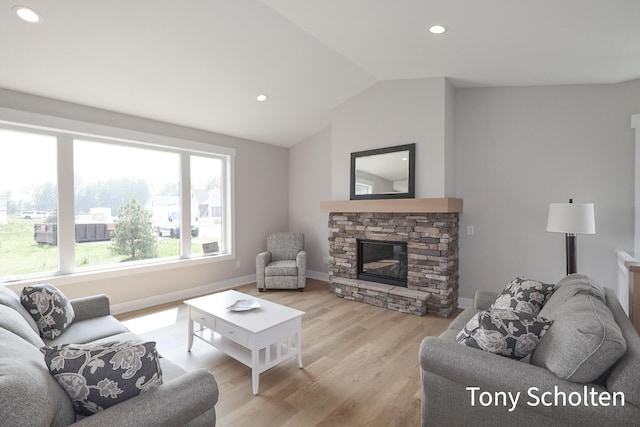 5184 Blendon Meadow Cir Unit 47, Hudsonville, MI 49426 - living room featuring vaulted ceiling, light wood-type flooring, recessed lighting, a fireplace, and baseboards