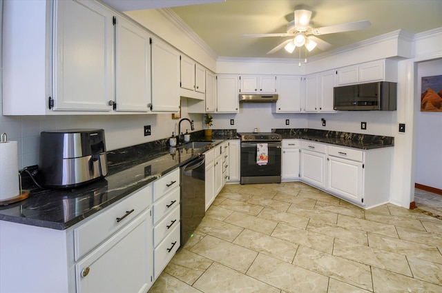 kitchen with dark stone countertops, sink, white cabinets, and stainless steel appliances