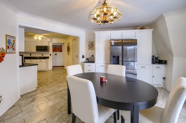 dining space with ceiling fan with notable chandelier and crown molding