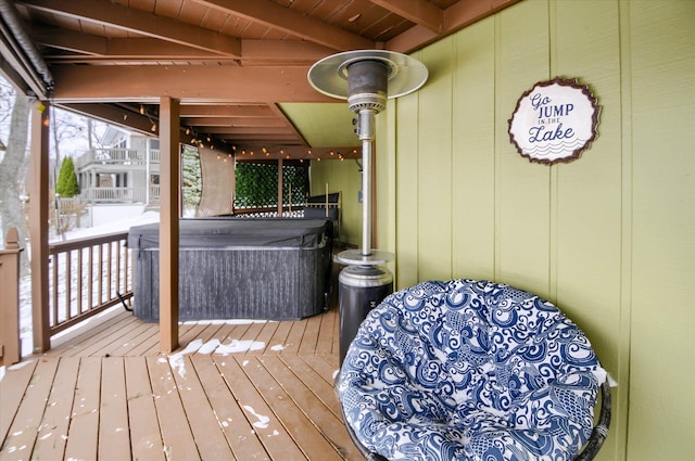 wooden terrace featuring a hot tub