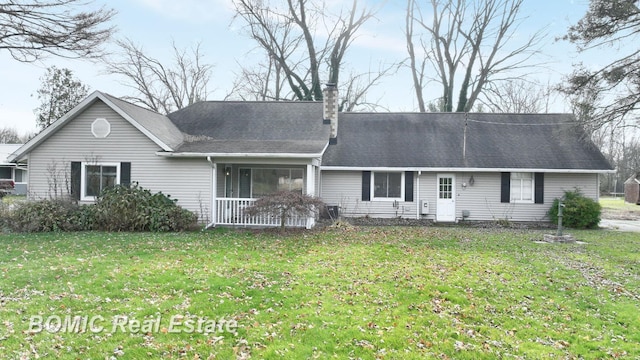 single story home with a front lawn and a porch