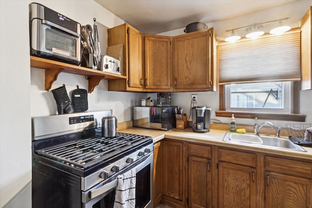 kitchen with stainless steel range with gas cooktop and sink