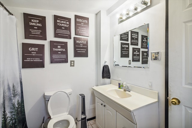 bathroom with tile patterned floors, vanity, vaulted ceiling, and toilet