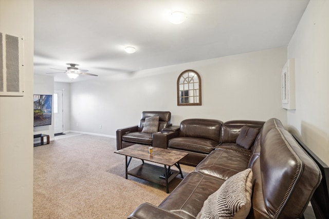 carpeted living room featuring ceiling fan