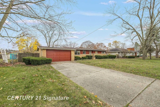 ranch-style house featuring a front lawn and a garage