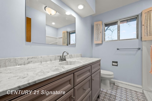 bathroom with baseboard heating, vanity, and toilet