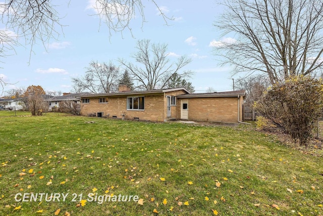 back of house with a yard