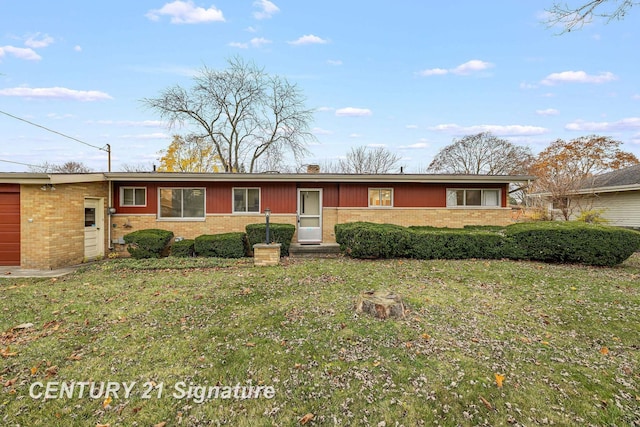 ranch-style home with a front lawn