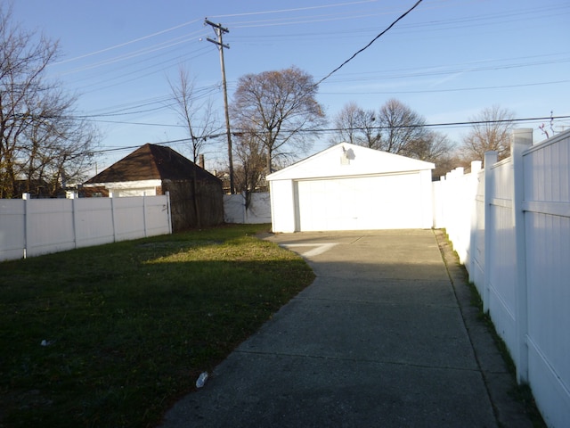 garage featuring a lawn