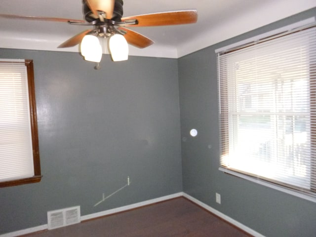 unfurnished room with ceiling fan