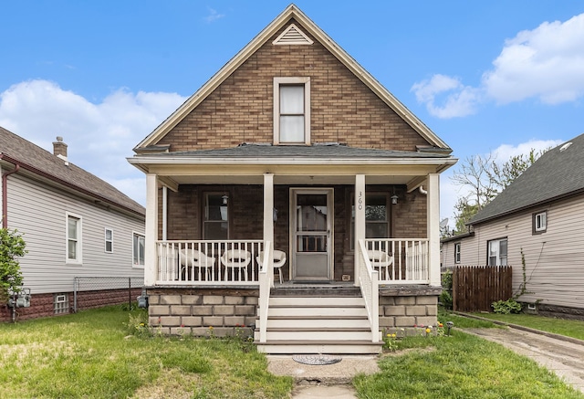 view of front of property featuring a porch and brick siding