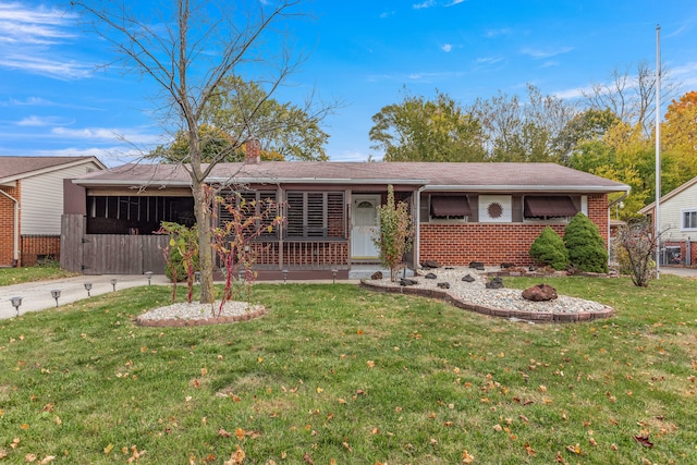 ranch-style house with a front lawn