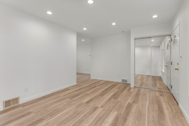 unfurnished room featuring light wood-type flooring