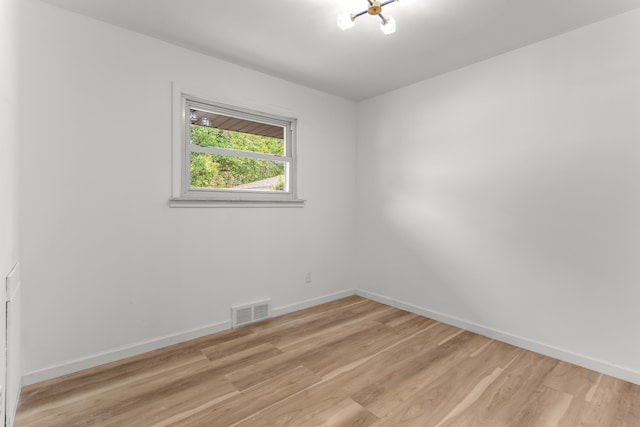 spare room featuring light hardwood / wood-style flooring