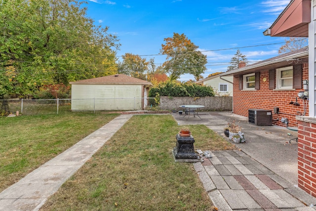 view of yard with an outbuilding and a patio