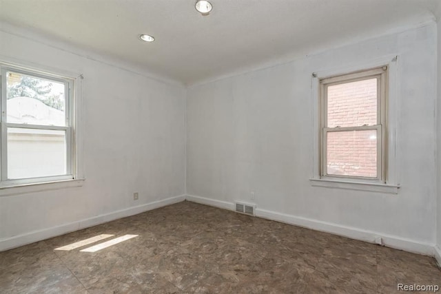 unfurnished room with plenty of natural light