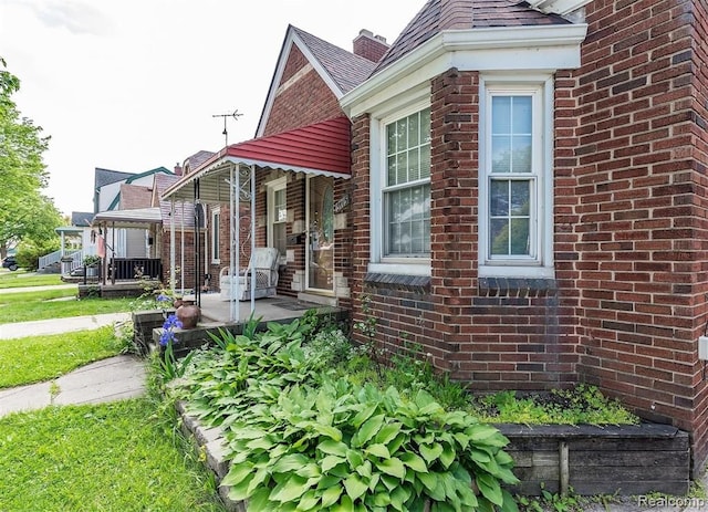 view of side of property with a porch