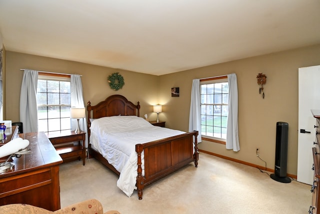 bedroom featuring light colored carpet