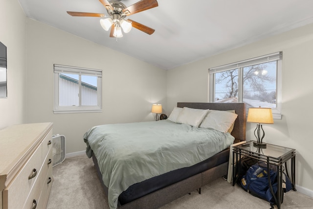 carpeted bedroom featuring ceiling fan and lofted ceiling