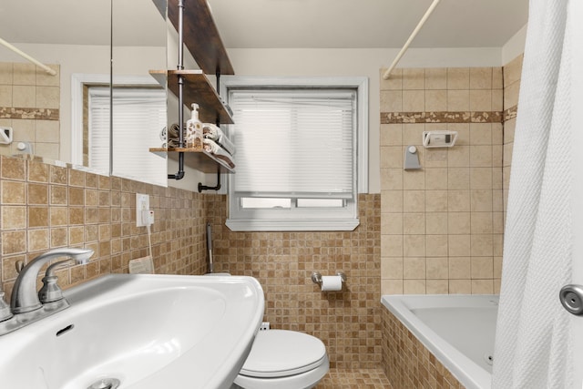 full bathroom featuring shower / bath combination with curtain, toilet, sink, and tile walls