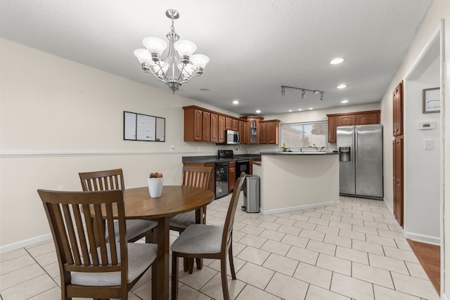 dining space featuring beverage cooler, a chandelier, and a textured ceiling