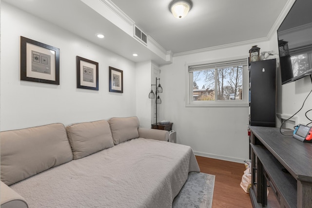 bedroom featuring dark hardwood / wood-style flooring and crown molding