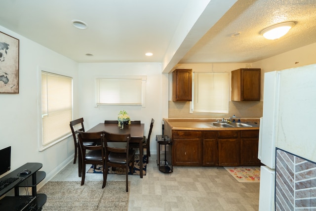 kitchen with sink and a textured ceiling