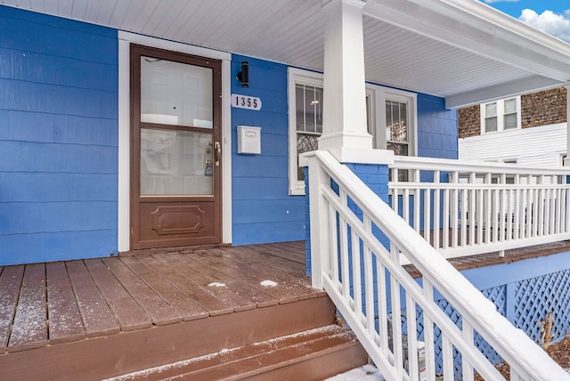 doorway to property featuring a porch